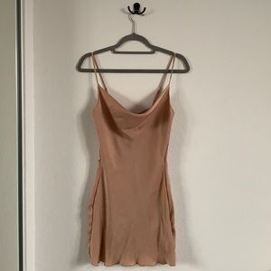 Super cute nude mini dress, very flattering, brand new, size small.